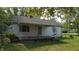 Quaint one story home with a small front porch and traditional architectural details at 6484 S State Road 39, Clayton, IN 46118
