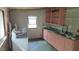 A laundry room with a washer, dryer, storage, and utility sink at 6484 S State Road 39, Clayton, IN 46118