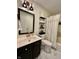 Updated bathroom with modern vanity, framed mirror, new lighting, and shower-tub combination at 6927 Havenmoor Pl, Indianapolis, IN 46250