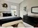 Comfortable bedroom with stylish black and white accents and a window view at 6927 Havenmoor Pl, Indianapolis, IN 46250