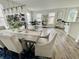 Bright dining room featuring stylish table with seating, modern lighting, and decor throughout at 6927 Havenmoor Pl, Indianapolis, IN 46250
