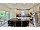 Modern kitchen featuring island with seating, stainless appliances, and lots of storage at 6927 Havenmoor Pl, Indianapolis, IN 46250