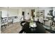 Open-concept living area with hardwood floors, a dining table, and a comfortable seating area at 6927 Havenmoor Pl, Indianapolis, IN 46250