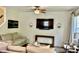 Cozy living room showcases stylish sofas, wooden accents, and entertainment setup at 6927 Havenmoor Pl, Indianapolis, IN 46250