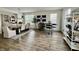 Spacious living room with hardwood floors, ample natural light, and modern decor at 6927 Havenmoor Pl, Indianapolis, IN 46250