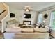 Spacious living room featuring plush sofas, accent chairs, and modern decor at 6927 Havenmoor Pl, Indianapolis, IN 46250