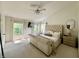 Bright main bedroom with vaulted ceiling, large windows, and upholstered sleigh bed at 6927 Havenmoor Pl, Indianapolis, IN 46250