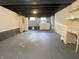 Unfinished basement area featuring laundry machines and storage cabinets in a neutral color palette at 706 N Euclid Ave, Indianapolis, IN 46201