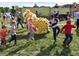 Festive community event with children playing and a vibrant lion dance at 706 N Euclid Ave, Indianapolis, IN 46201