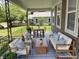 The front porch is furnished with comfortable seating, perfect for relaxing at 706 N Euclid Ave, Indianapolis, IN 46201