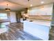 Modern kitchen with a center island, stainless steel appliances, and light-filled rooms at 706 N Euclid Ave, Indianapolis, IN 46201