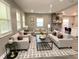 This open-concept living room features a modern fireplace and stylish decor at 706 N Euclid Ave, Indianapolis, IN 46201