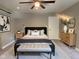 Comfortable staged bedroom with a plush bed, stylish decor, and ample natural light at 706 N Euclid Ave, Indianapolis, IN 46201