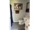 Tidy bathroom with unique world map decor, towel rack, and ample storage at 707 S Harrison St, Alexandria, IN 46001