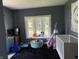 Bedroom featuring ample natural light from the bay window, with space for play and rest at 707 S Harrison St, Alexandria, IN 46001