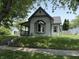 Charming single-story home with inviting front porch and well-maintained lawn on a sunny day at 707 S Harrison St, Alexandria, IN 46001