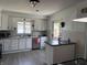 Well-lit kitchen with white cabinets, stainless steel appliances, and a functional center island at 707 S Harrison St, Alexandria, IN 46001
