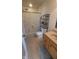 Bathroom featuring a shower with a decorative shower curtain, toilet, and vanity at 713 Driftwood Cir, Danville, IN 46122