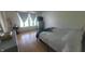 Comfortable bedroom with wood-look floors, soft natural light and modern furniture at 713 Driftwood Cir, Danville, IN 46122