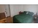 Bedroom featuring a double bed, closet, and wood-look flooring at 713 Driftwood Cir, Danville, IN 46122