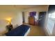 Bedroom featuring a bed, dresser, television, and wood-look flooring at 713 Driftwood Cir, Danville, IN 46122