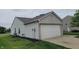 Home featuring a two-car garage and clean vinyl siding at 713 Driftwood Cir, Danville, IN 46122