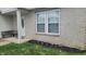 Charming front yard featuring a bench, flowers, and decorative accents at 713 Driftwood Cir, Danville, IN 46122