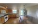 Eat in kitchen features wood cabinets, modern appliances and plenty of natural light at 713 Driftwood Cir, Danville, IN 46122