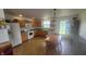 Bright kitchen featuring natural wood cabinets, modern appliances, and a dining area at 713 Driftwood Cir, Danville, IN 46122