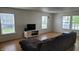 Bright living room with large windows offering plenty of natural light at 713 Driftwood Cir, Danville, IN 46122