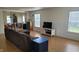 Bright and airy living room boasts wood-look floors and neutral paint at 713 Driftwood Cir, Danville, IN 46122