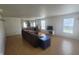 Bright living room featuring wood-look flooring, modern fixtures and natural light at 713 Driftwood Cir, Danville, IN 46122