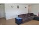 Cozy living room with neutral walls, stylish sconces, and wood-look flooring at 713 Driftwood Cir, Danville, IN 46122