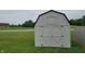 Outdoor shed with a double door, offering ample storage space at 713 Driftwood Cir, Danville, IN 46122