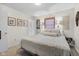 Serene bedroom with a comfortable bed, neutral decor, and natural light at 762 N Dellasburg Rd, Columbus, IN 47203
