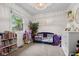Brightly decorated Bedroom with a blue crib, colorful books, and decorative wall art at 762 N Dellasburg Rd, Columbus, IN 47203