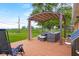 Outdoor deck with comfortable seating, pergola, and a grill, perfect for backyard entertaining at 762 N Dellasburg Rd, Columbus, IN 47203