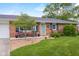 Inviting porch with seating area and attractive landscaping, offering curb appeal and charm at 762 N Dellasburg Rd, Columbus, IN 47203