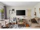 Comfortable living room showcasing modern decor, including a large screen TV and stylish furnishings at 762 N Dellasburg Rd, Columbus, IN 47203
