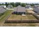 Aerial view showcasing the home's fenced backyard and surrounding neighborhood at 7834 Fairwood Blvd, Plainfield, IN 46168