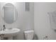 Well-lit half bathroom featuring modern fixtures, mirror, and fresh decor at 7834 Fairwood Blvd, Plainfield, IN 46168