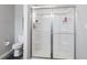 Bathroom featuring a shower with sliding glass doors and a modern toilet at 7834 Fairwood Blvd, Plainfield, IN 46168