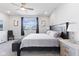 Bright bedroom featuring a ceiling fan and a large window with a view at 7834 Fairwood Blvd, Plainfield, IN 46168