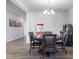 Dining room featuring a round table, four chairs, and an arcade game machine at 7834 Fairwood Blvd, Plainfield, IN 46168