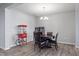 Open concept dining room featuring a round table, chairs, and popcorn machine at 7834 Fairwood Blvd, Plainfield, IN 46168