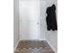Entryway with a white door, hook rack with coats, and decorative black and tan mat at 7834 Fairwood Blvd, Plainfield, IN 46168