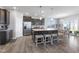 Modern kitchen with stainless appliances, spacious island, and an eat-in dining area at 7834 Fairwood Blvd, Plainfield, IN 46168