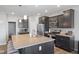 Well-equipped kitchen featuring an island with barstool seating and stainless steel appliances at 7834 Fairwood Blvd, Plainfield, IN 46168