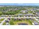 Beautiful aerial view of a suburban neighborhood with well-maintained lawns and community pond at 8044 Yarmouth Way, Indianapolis, IN 46239
