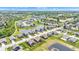 Aerial view of a suburban neighborhood featuring pond and modern-style homes at 8044 Yarmouth Way, Indianapolis, IN 46239